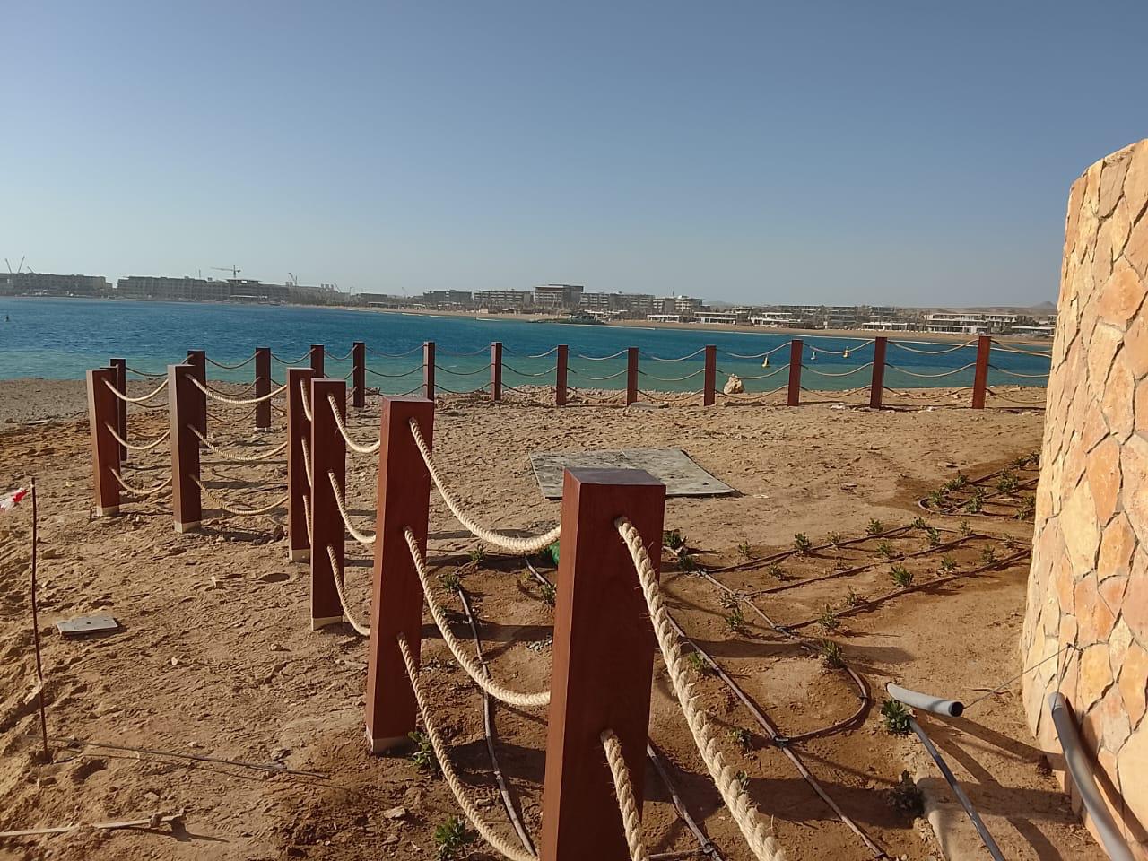 Beachfront construction with rope barriers